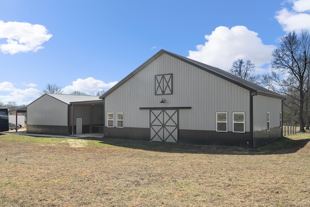 view of pole building with a lawn