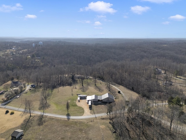 drone / aerial view featuring a rural view and a forest view