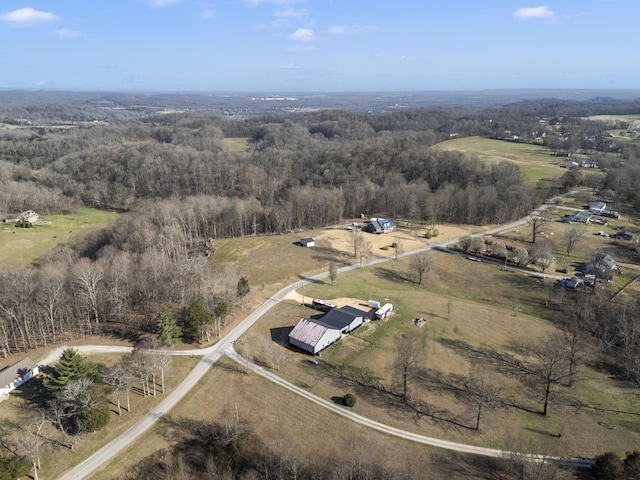 aerial view with a rural view and a wooded view