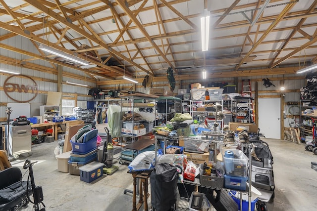 garage featuring metal wall and a workshop area