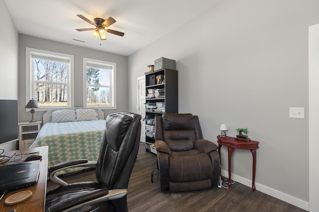 home office featuring visible vents, wood finished floors, baseboards, and ceiling fan