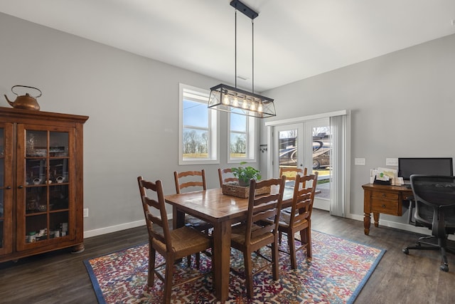 dining room with french doors, dark wood-style flooring, and baseboards