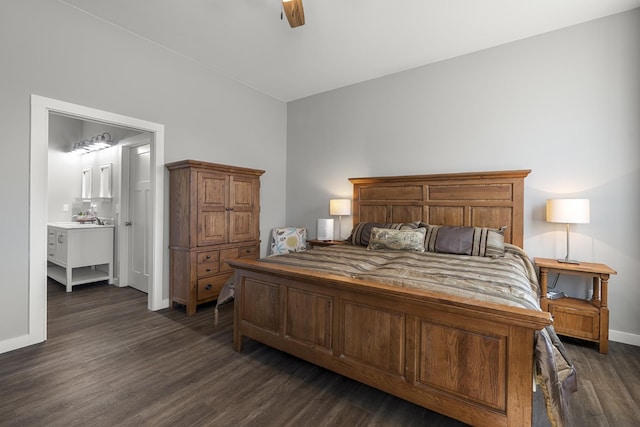 bedroom with ceiling fan, connected bathroom, baseboards, and dark wood-style floors