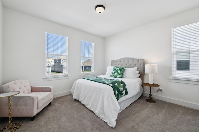 carpeted bedroom with baseboards