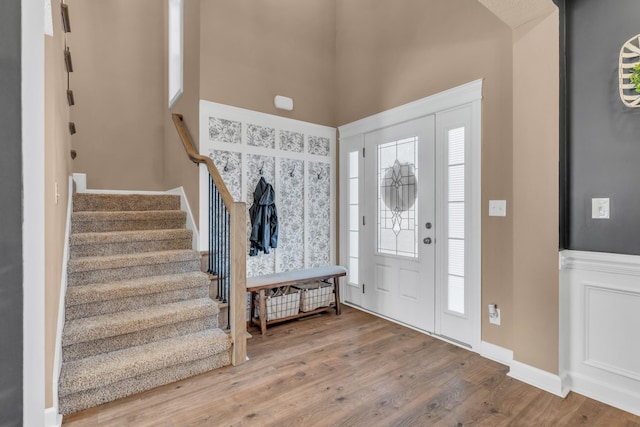 entryway featuring stairway and wood finished floors