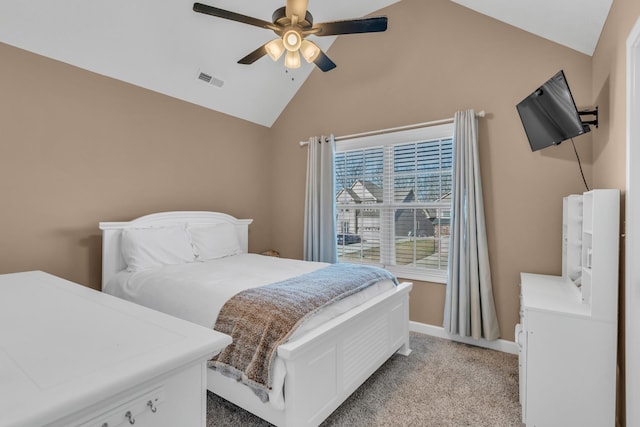 bedroom featuring visible vents, baseboards, light colored carpet, lofted ceiling, and a ceiling fan