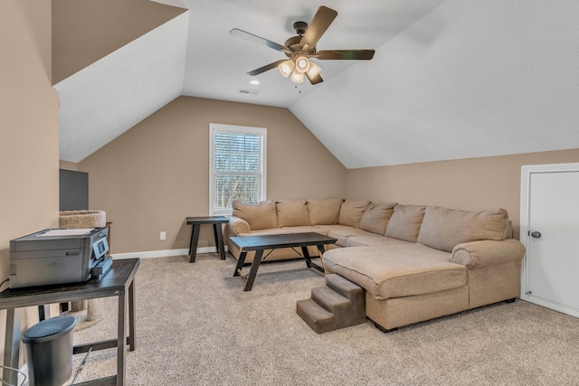 carpeted living room featuring visible vents, baseboards, ceiling fan, and vaulted ceiling