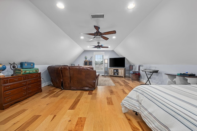 bedroom with lofted ceiling, recessed lighting, visible vents, and light wood-type flooring