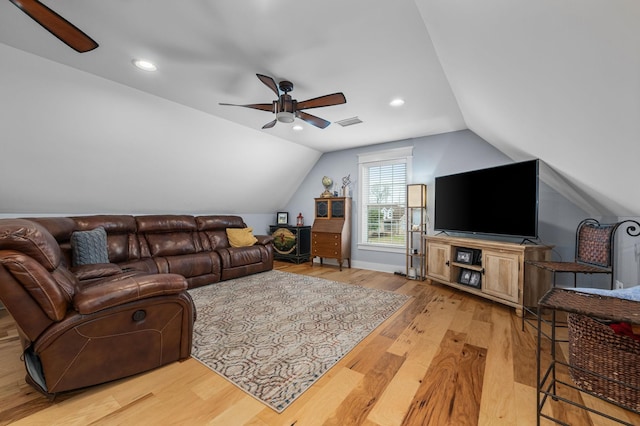 living room with wood finished floors, a ceiling fan, visible vents, lofted ceiling, and recessed lighting