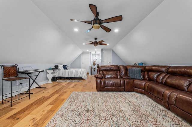 living room with wood finished floors, a ceiling fan, baseboards, recessed lighting, and vaulted ceiling