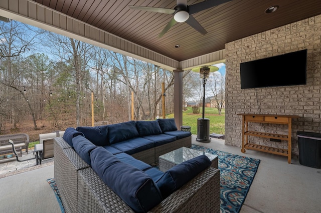 view of patio with outdoor lounge area and a ceiling fan