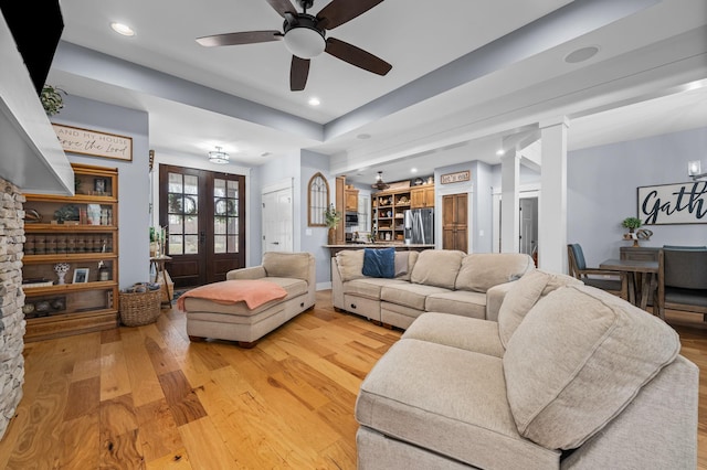 living room featuring recessed lighting, french doors, light wood-style floors, and ceiling fan