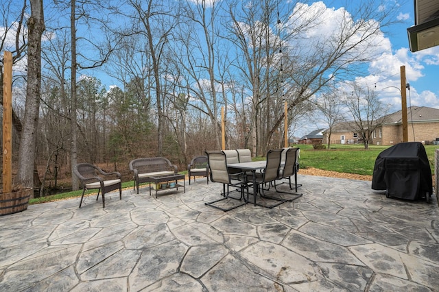 view of patio with outdoor dining space and area for grilling