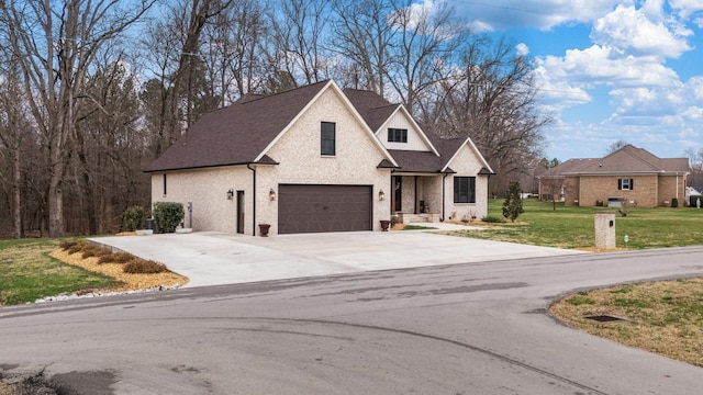 view of front facade with a front yard, roof with shingles, an attached garage, concrete driveway, and brick siding