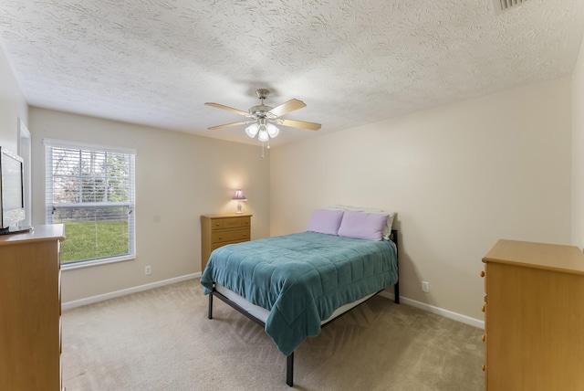 bedroom with baseboards, carpet floors, and a ceiling fan