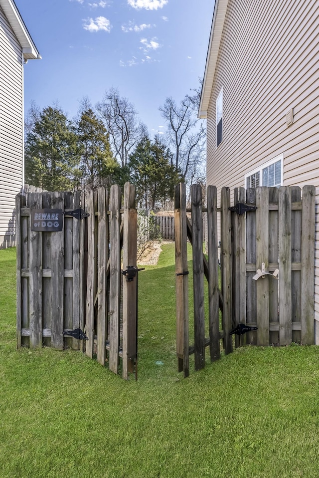 view of yard with a gate and fence