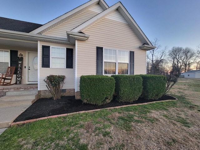 view of home's exterior featuring crawl space and covered porch