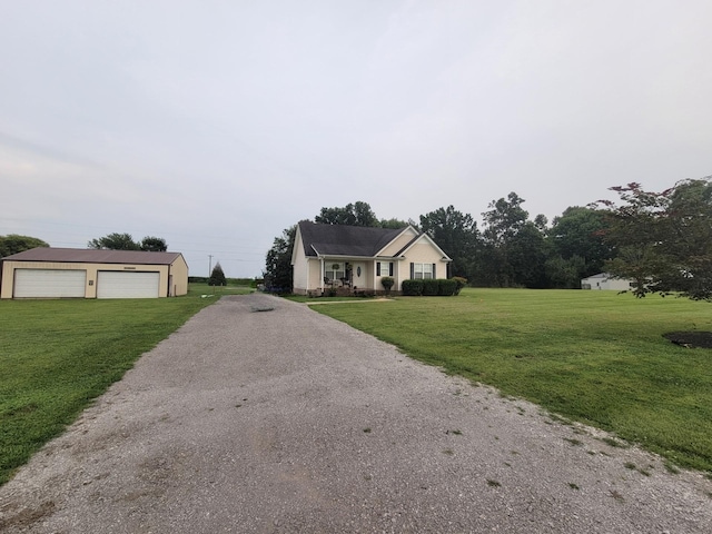 view of front of property featuring a garage, an outdoor structure, and a front yard