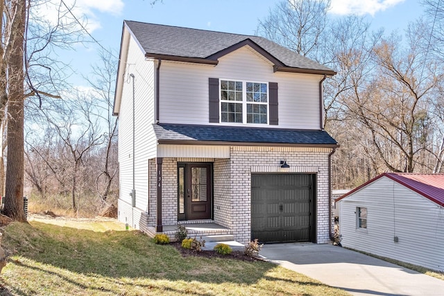 traditional home featuring a front lawn, concrete driveway, an attached garage, and a shingled roof