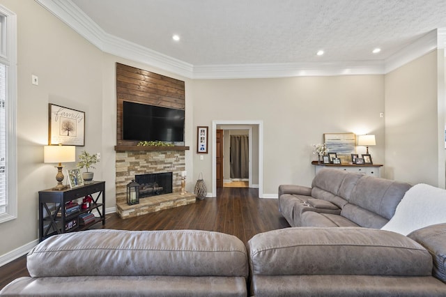 living area with dark wood-style floors, baseboards, a fireplace, and crown molding