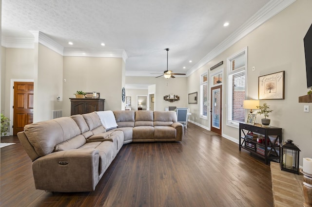 living area with crown molding, recessed lighting, dark wood-type flooring, baseboards, and ceiling fan