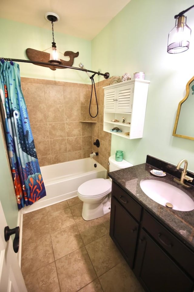 full bathroom featuring tile patterned floors, toilet, shower / bath combo with shower curtain, and vanity