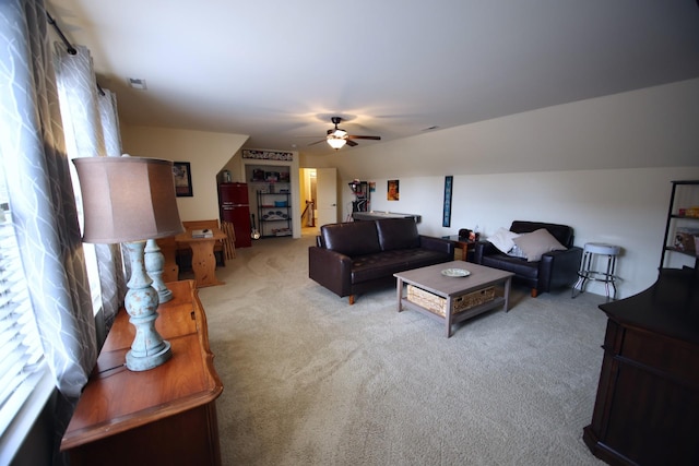 living room with a ceiling fan and carpet floors