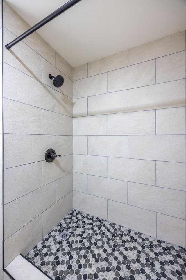 bathroom with tiled shower