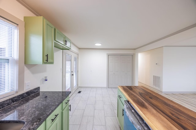 kitchen featuring visible vents, ornamental molding, and green cabinetry