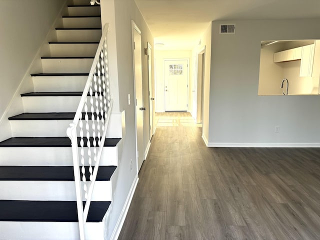 1239 N Graycroft Ave, Madison, TN 37115 - staircase with visible vents, baseboards, and wood finished floors