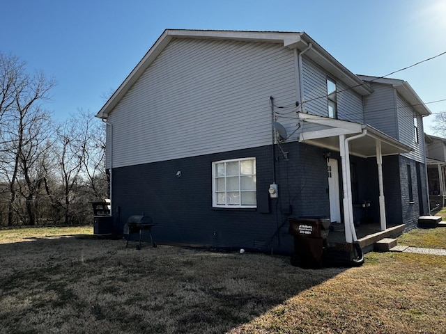 1239 N Graycroft Ave, Madison, TN 37115 - view of property exterior with a lawn, a porch, and brick siding