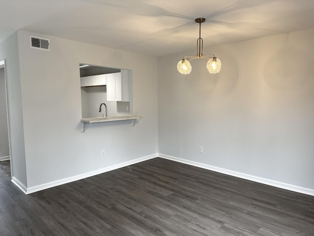 1239 N Graycroft Ave, Madison, TN 37115 - unfurnished dining area featuring dark wood-type flooring, baseboards, visible vents, and a sink