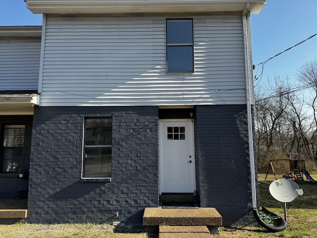 1239 N Graycroft Ave, Madison, TN 37115 - view of front of house featuring brick siding and a playground