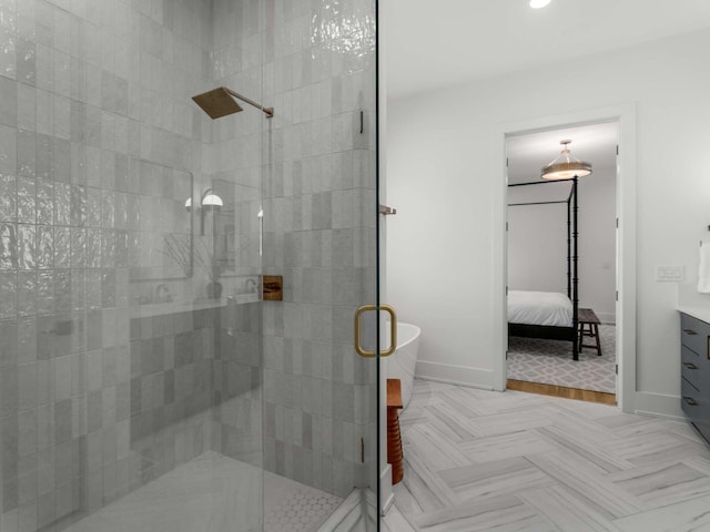 bathroom featuring vanity, baseboards, recessed lighting, connected bathroom, and a shower stall