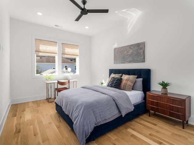 bedroom featuring visible vents, baseboards, recessed lighting, a ceiling fan, and light wood-style flooring