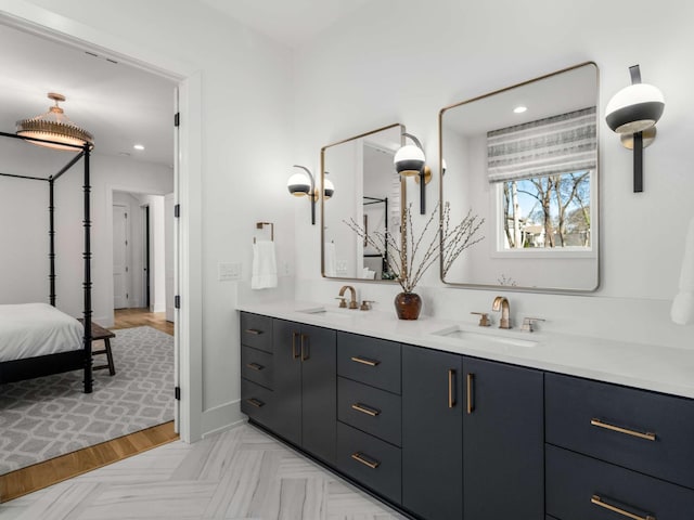 full bath with recessed lighting, a sink, connected bathroom, and double vanity