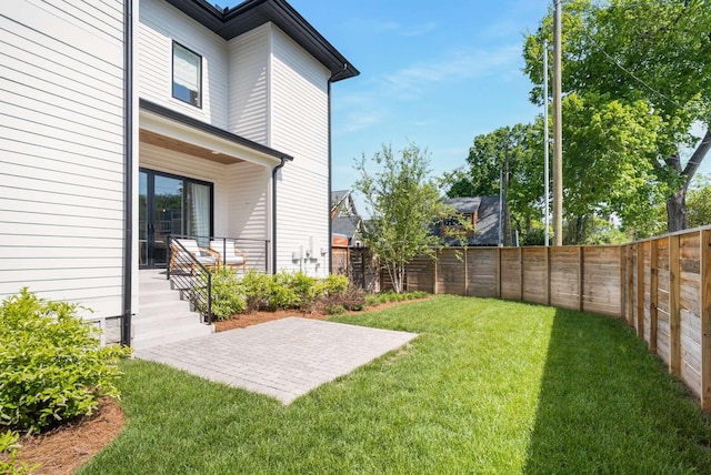 view of yard featuring a patio and a fenced backyard
