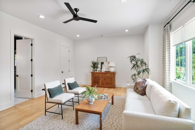 sitting room with recessed lighting, a ceiling fan, baseboards, and light wood-type flooring
