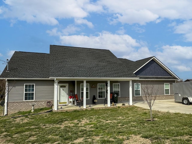 670 Jones Franklin Rd, Morristown, TN 37813 - view of front of property featuring brick siding, a front yard, and roof with shingles