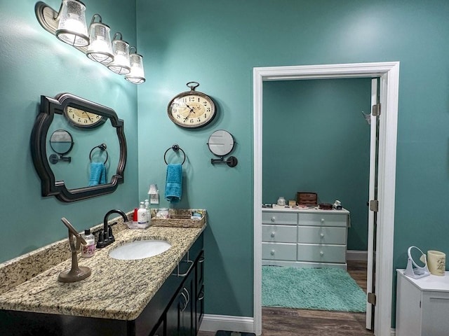 670 Jones Franklin Rd, Morristown, TN 37813 - bathroom featuring vanity, wood finished floors, and baseboards