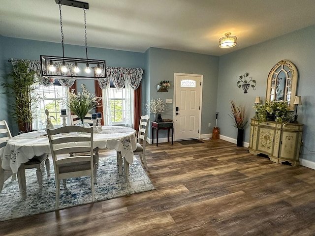 670 Jones Franklin Rd, Morristown, TN 37813 - dining space featuring wood finished floors, baseboards, and a chandelier