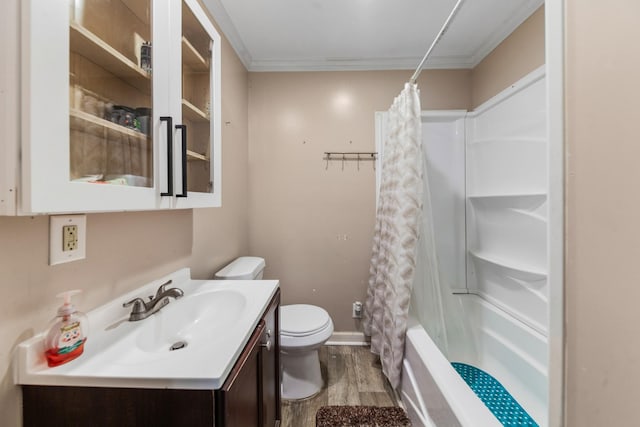 full bathroom featuring vanity, wood finished floors, ornamental molding, shower / bath combination with curtain, and toilet