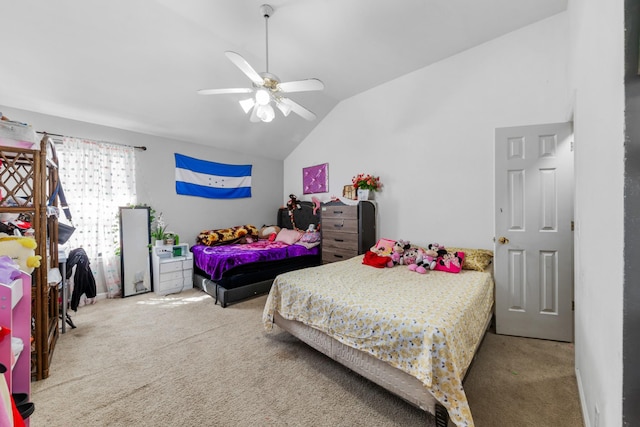 carpeted bedroom with ceiling fan and vaulted ceiling