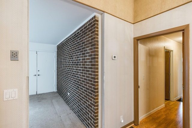 hall with brick wall