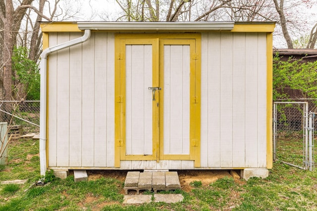view of shed with fence
