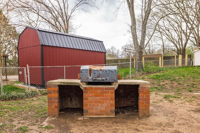 view of outbuilding featuring an outbuilding and fence