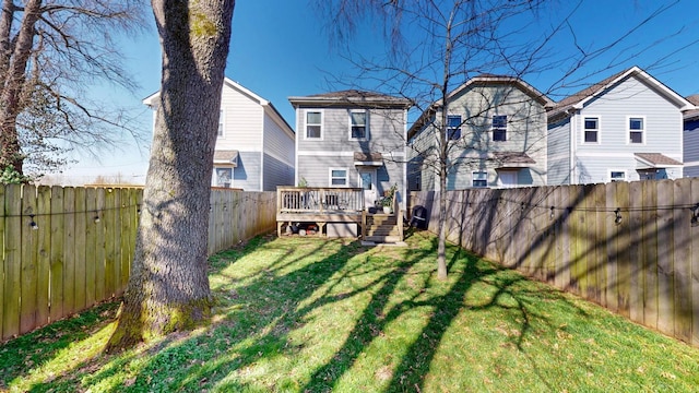 view of yard with a deck and a fenced backyard