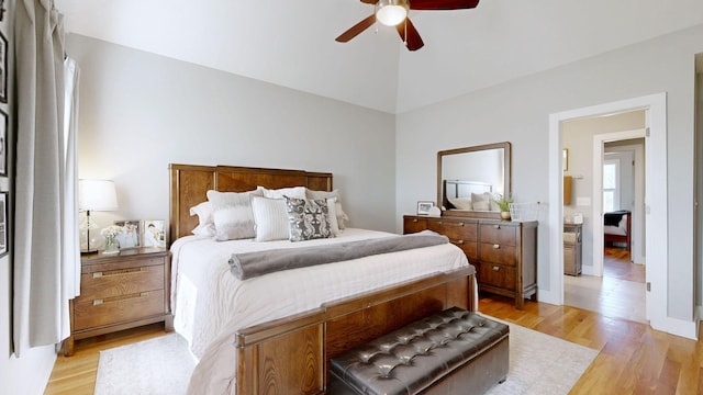 bedroom with lofted ceiling, ceiling fan, and light wood finished floors
