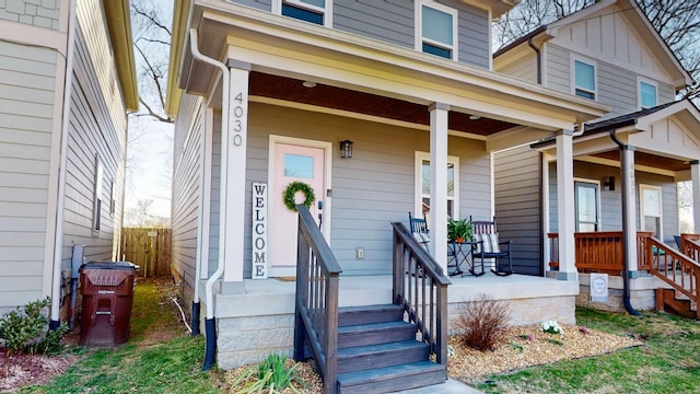 view of exterior entry with covered porch
