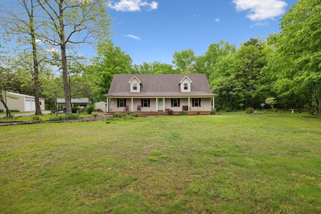 cape cod house featuring a porch and a front yard